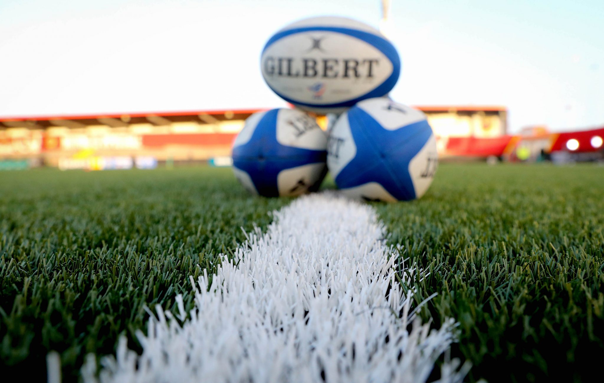 rugby balls on pitch